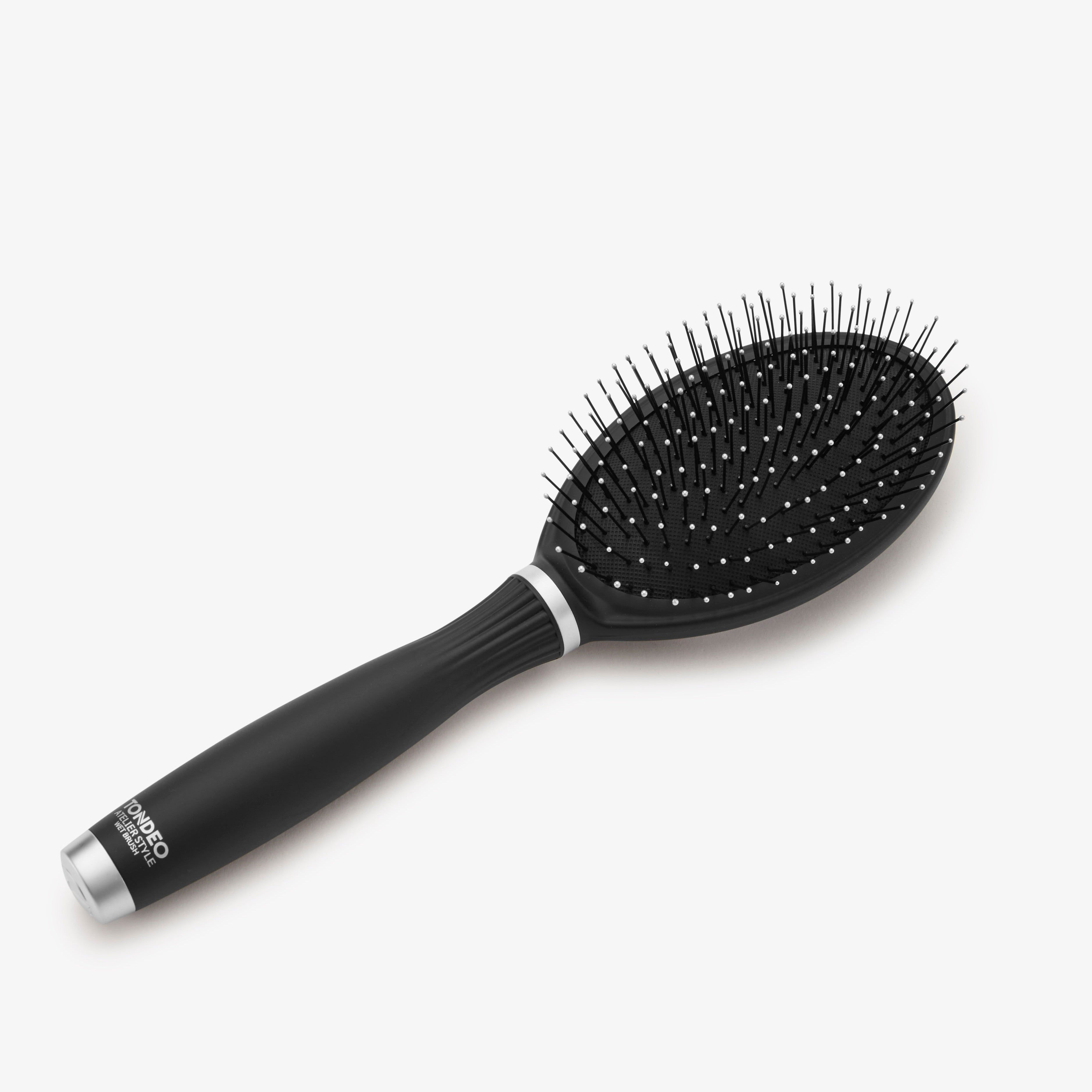 Black hairbrush from TONDEO , combing/detangling hair, styling, volume, detangling wet hair, and brushing extensions and wigs. Antistatic bristles.