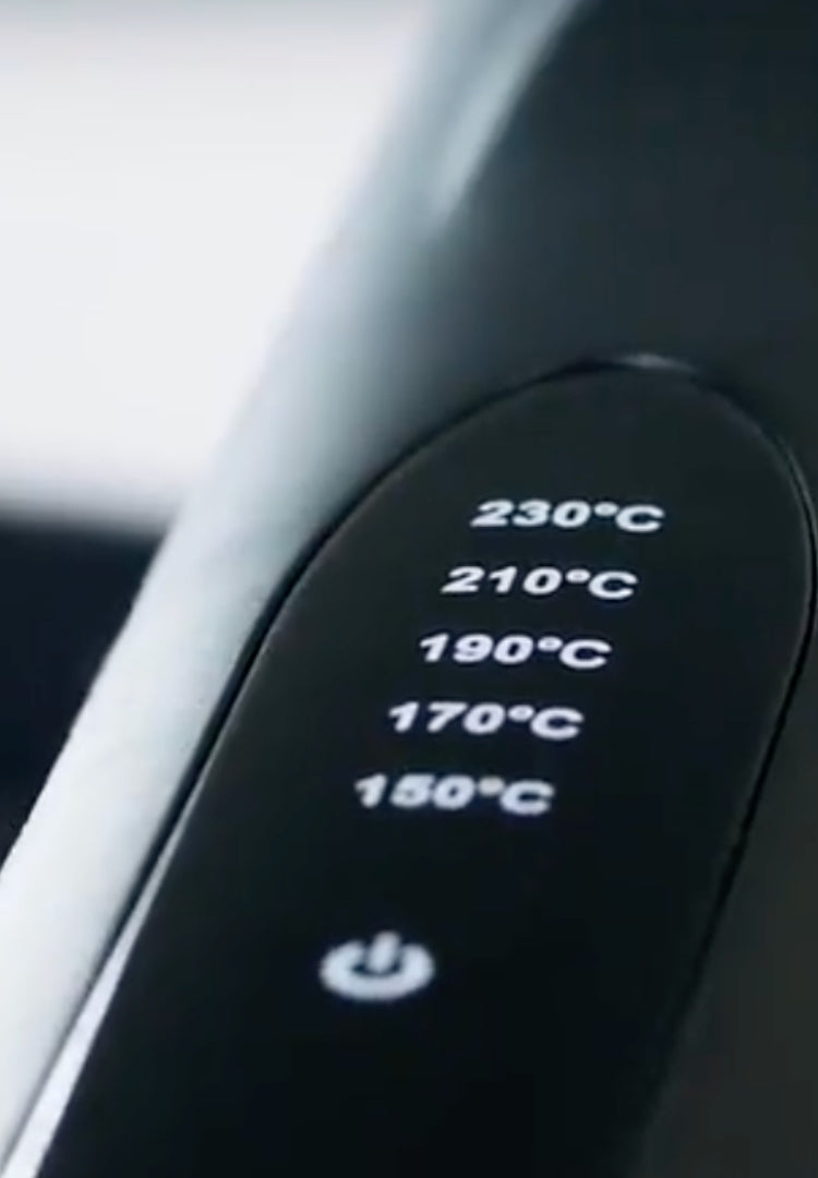 Temperatureinstellungen an Friseurwerkzeug Nahaufnahme